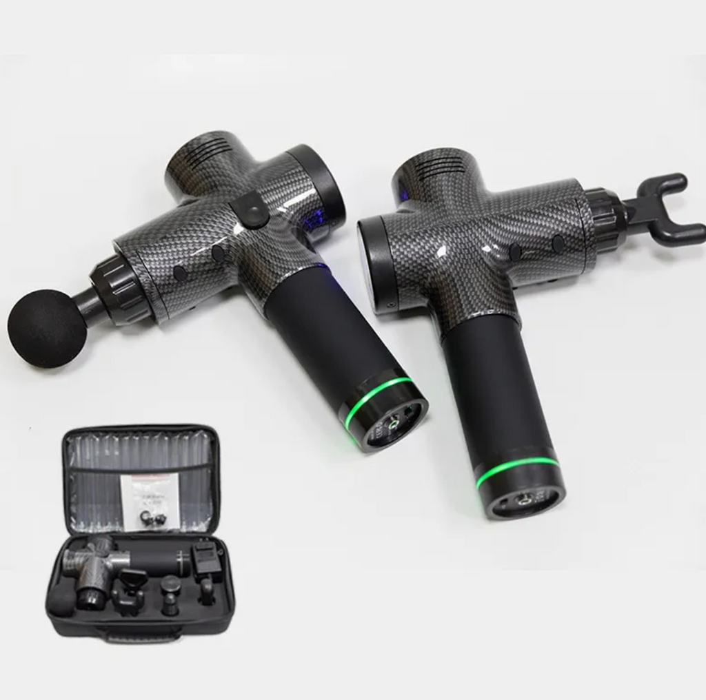 Massage gun and accessories on a white background